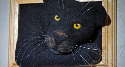 Schwarzer Panther im Bilderrahmen